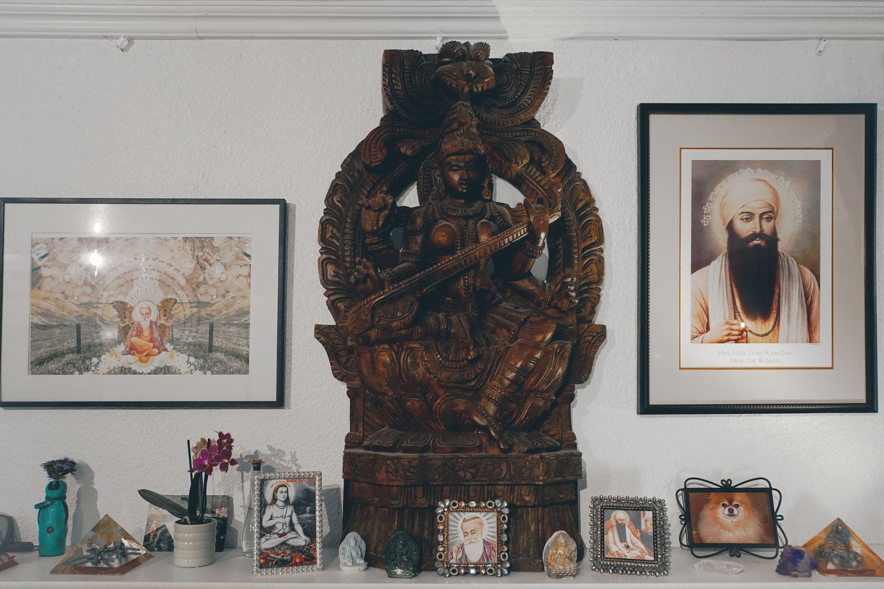 Yoga blankets in a woven basket at The MataJi Sanctuary, with candles, crystals, and books creating a peaceful meditation space.