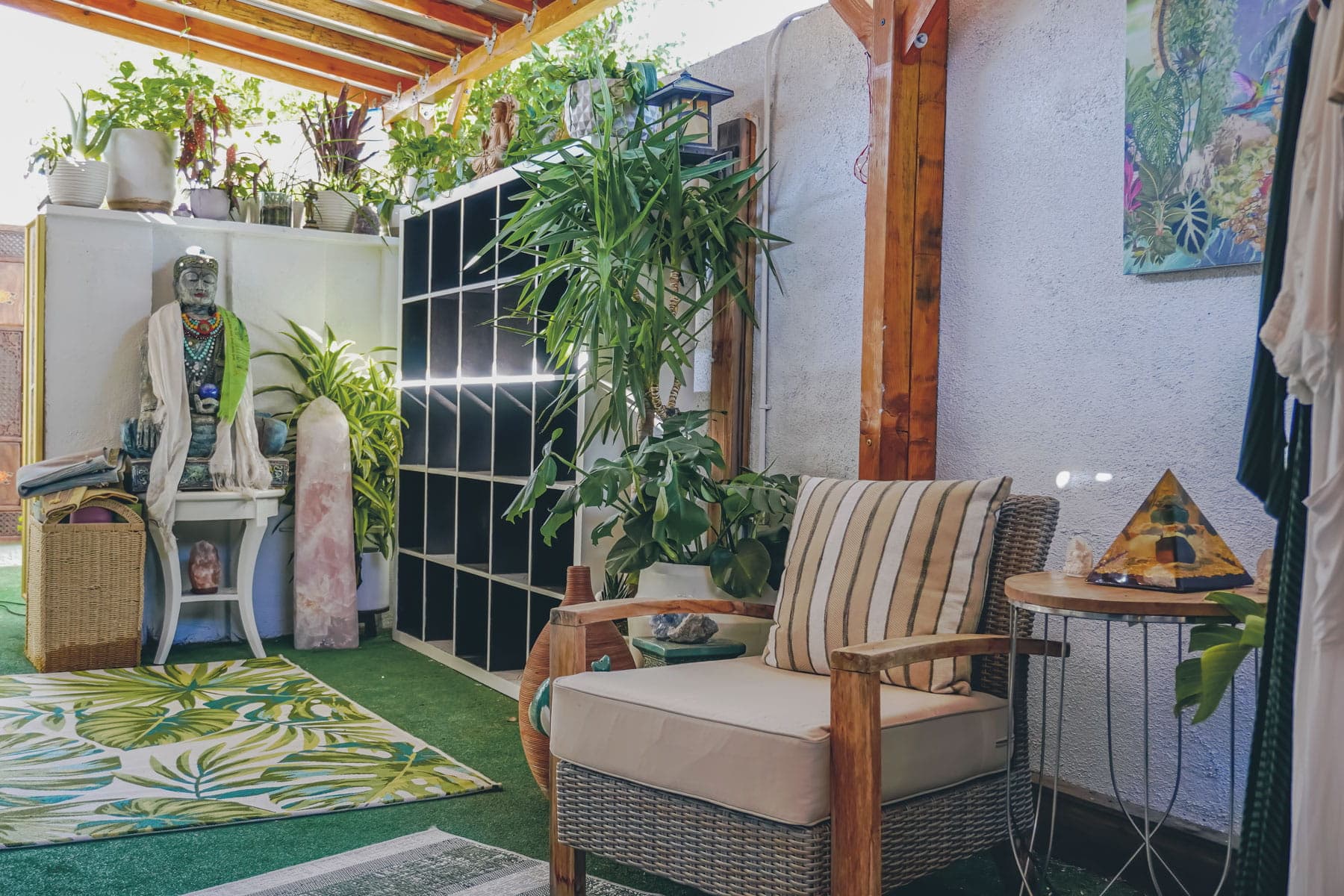 Cozy seating area with plants, crystals, and natural light at The MataJi Sanctuary for meditation and reflection.