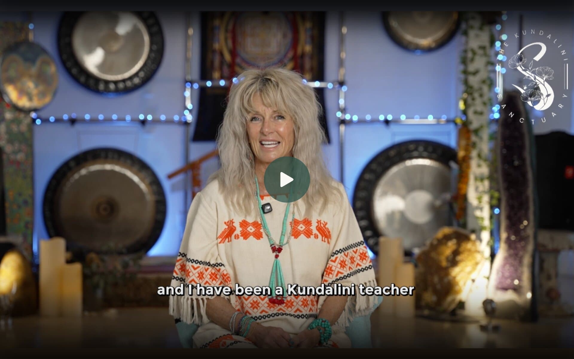 Melanie MataJi at The MataJi Sanctuary, seated with gongs and candles, discussing her experience as a Kundalini yoga teacher.